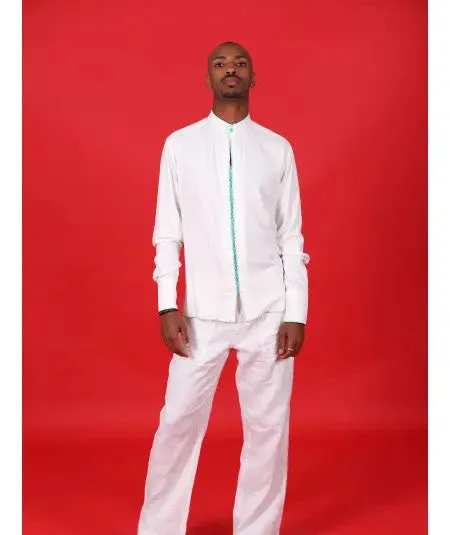 White tunic with green stitching