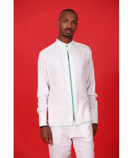 White tunic with green stitching